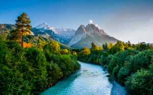 Loisach river in front of the Wetterstein Mountains with Alpspitze and Waxenstein view from Garmisch-Partenkirchen, Werdenfelser Land, romantic evening mood Loisach river in front of the Wetterstein Mountains with Alpspitze and Waxenstein view from Garmisch-Partenkirchen, Werdenfelser Land, romantic evening mood